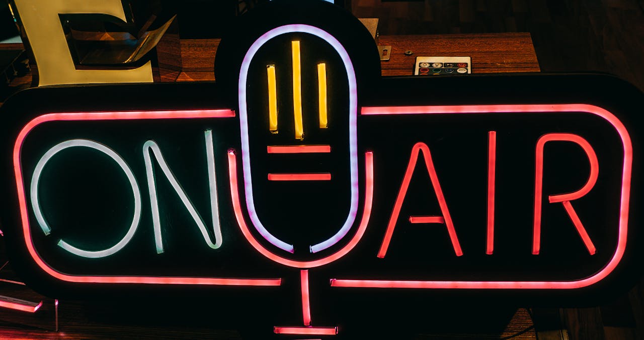 services-02 Bright neon On Air sign glowing in a dark studio, perfect for broadcasting themes.